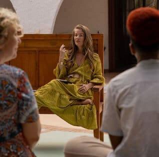 Eva-in-a-green-dress-on-a-bench
